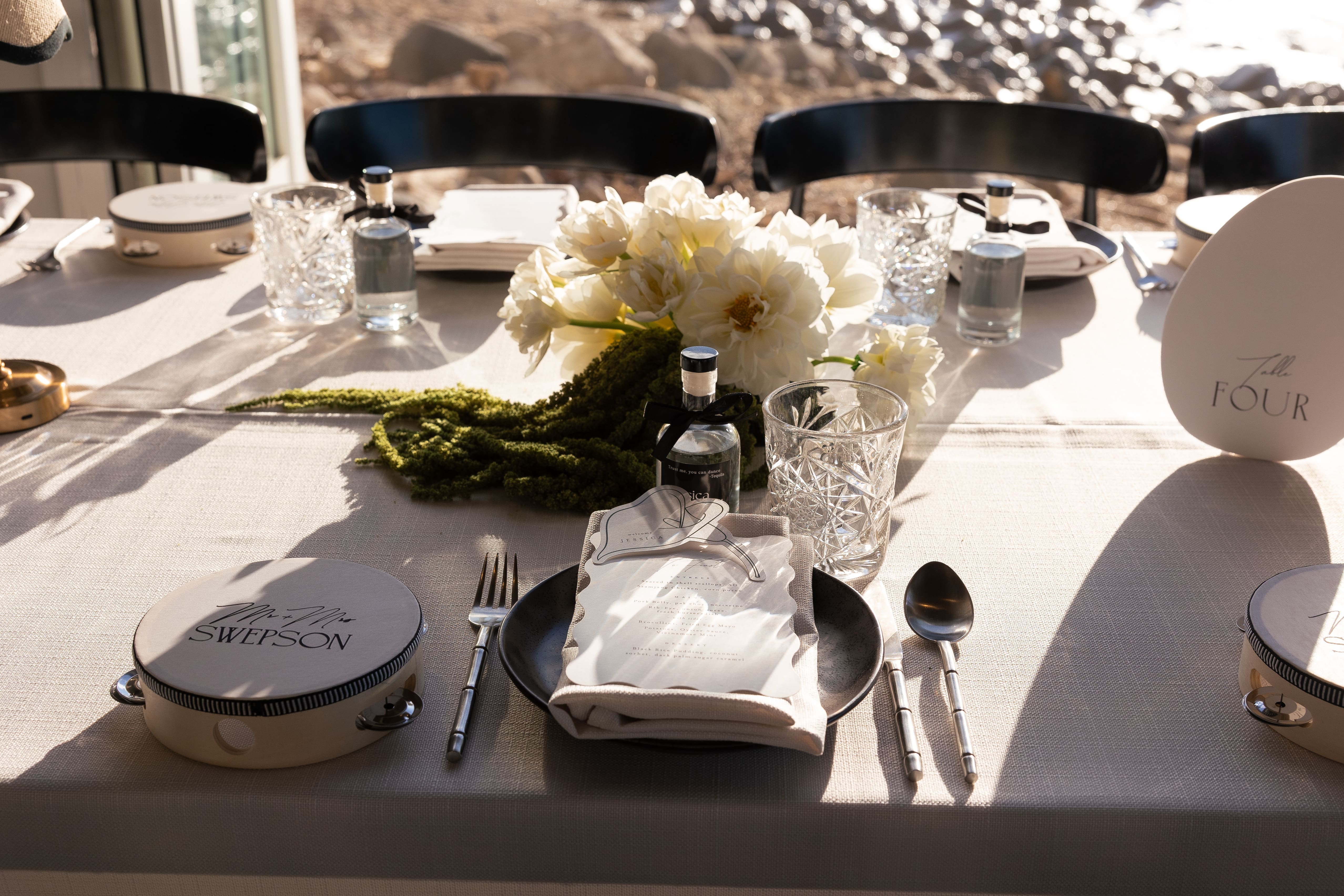 Modern Brisbane wedding reception table styled with white floral centrepieces, cascading green amaranthus and elegant table décor.
