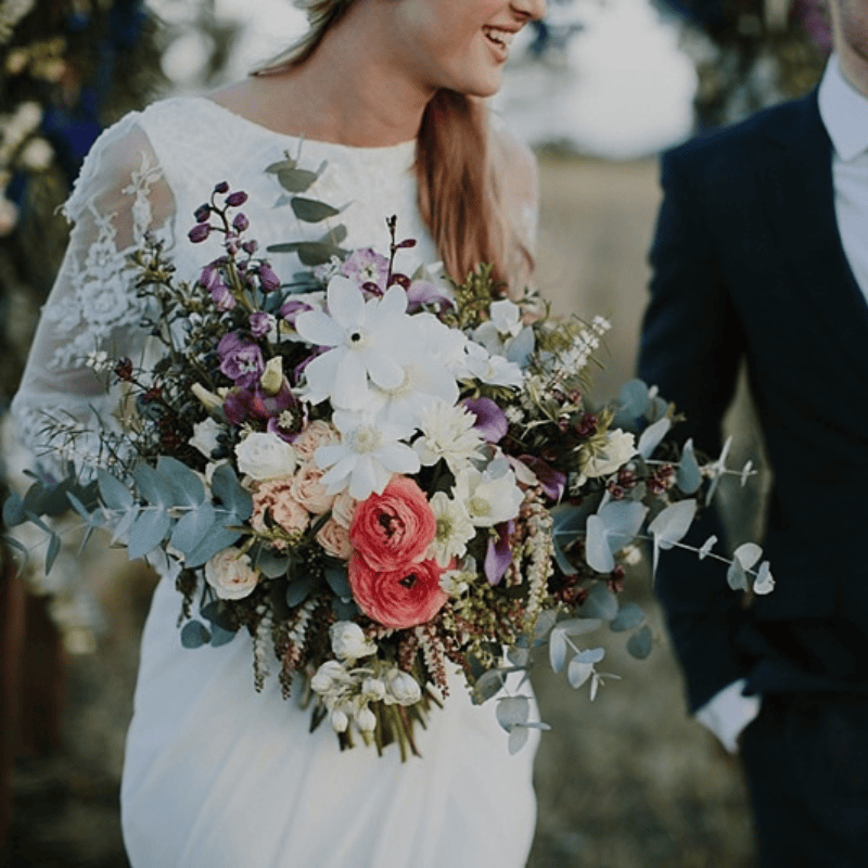 Bride with colourful wedding bouquet at a celebration