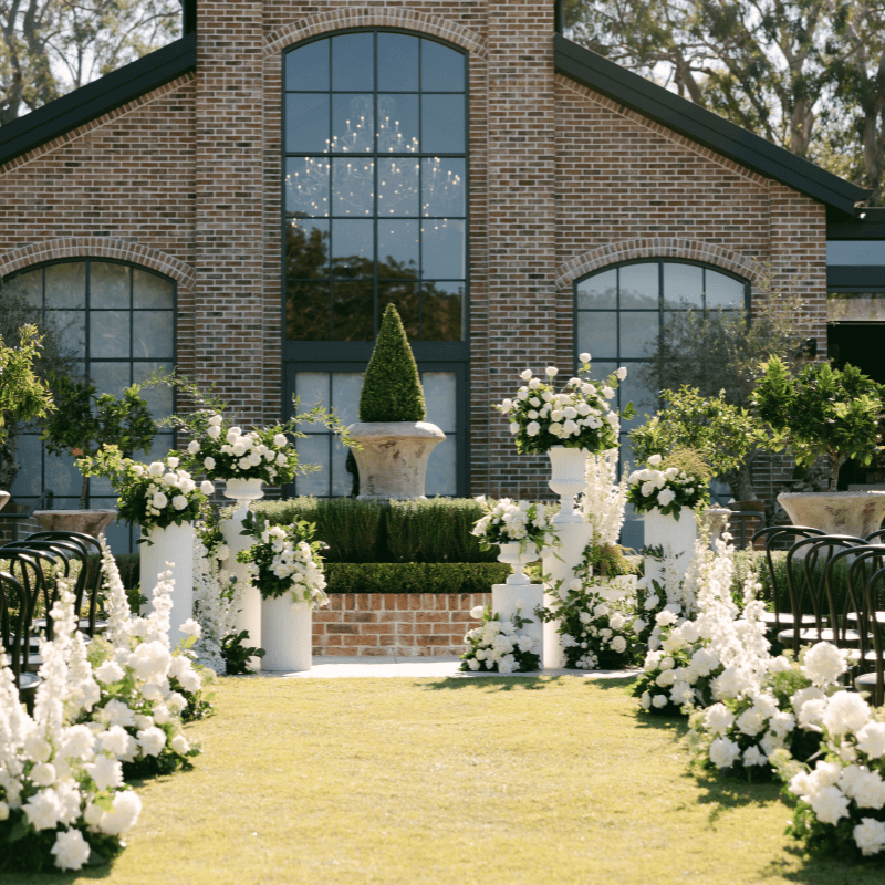 Outdoor wedding ceremony flowers at a Brisbane venue